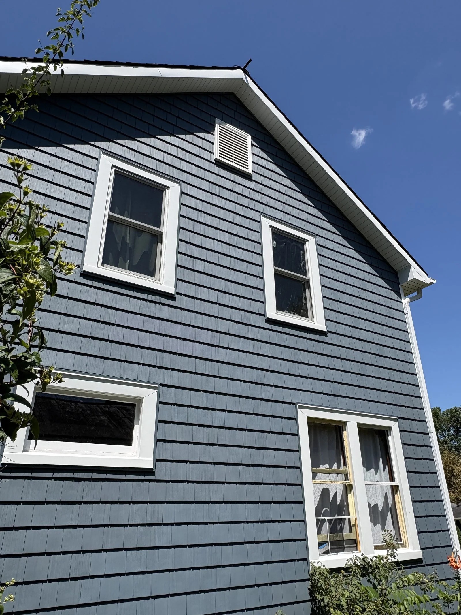 Blue-gray siding and gable detail